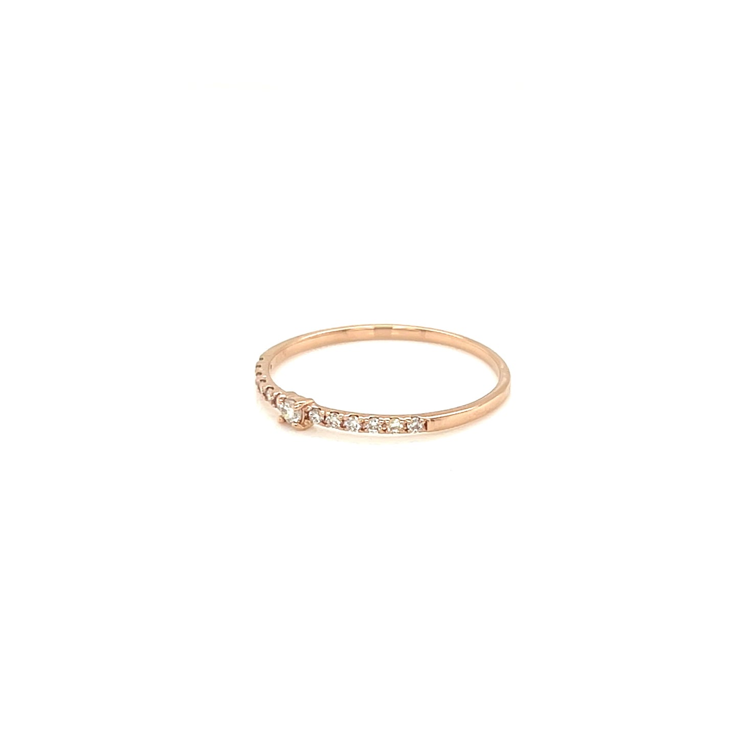 Rose gold ring with small diamonds on a white background