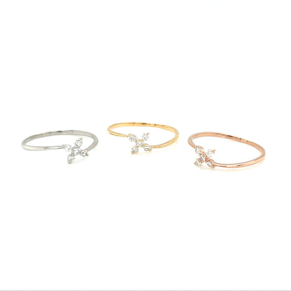 Three delicate bracelets in silver, gold, and rose gold on a white background