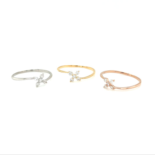 Three delicate bracelets in silver, gold, and rose gold on a white background