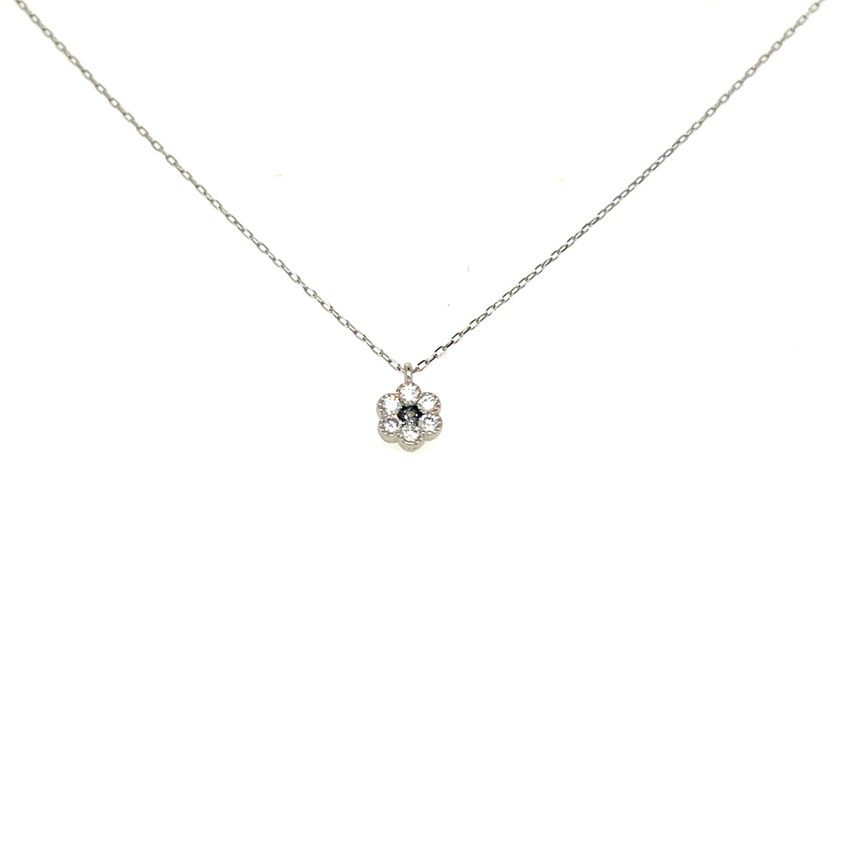 A delicate silver chain necklace with a small flower-shaped pendant featuring a clear central stone and silver petals, shown against a plain white background.