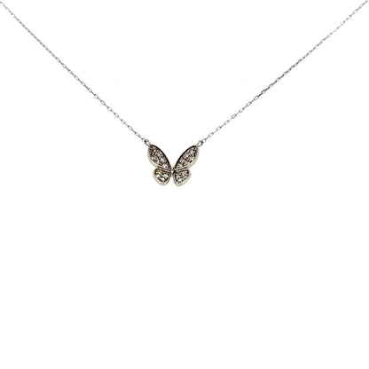 Butterfly-shaped necklace with diamonds on a thin chain against a white background