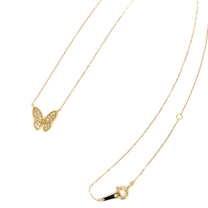 Gold butterfly necklace on a white background