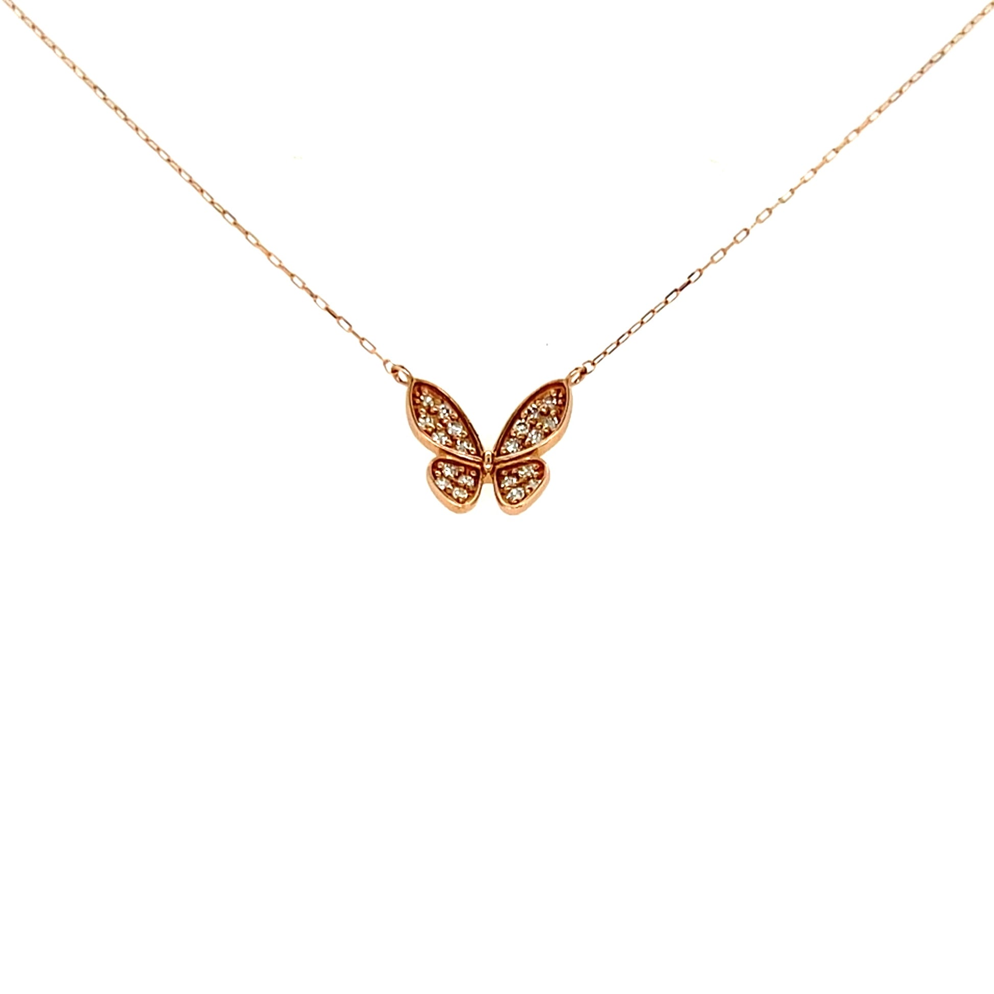 Rose gold butterfly necklace on a white background