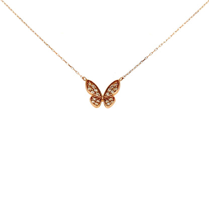 Rose gold butterfly necklace on a white background