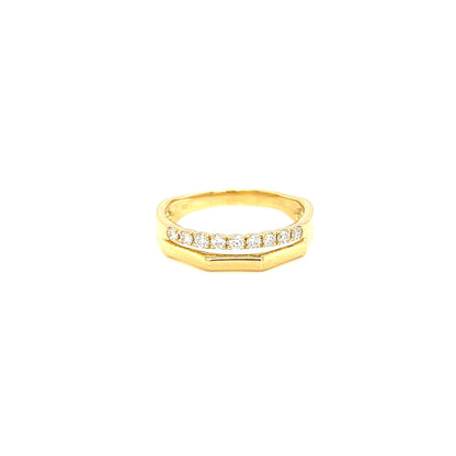 Gold ring with small diamonds on a white background