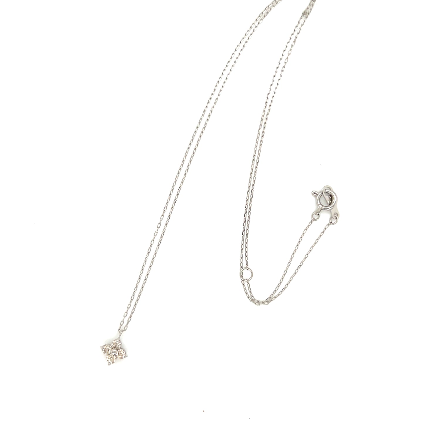 Platinum necklace with a delicate clover pendant on a white background
