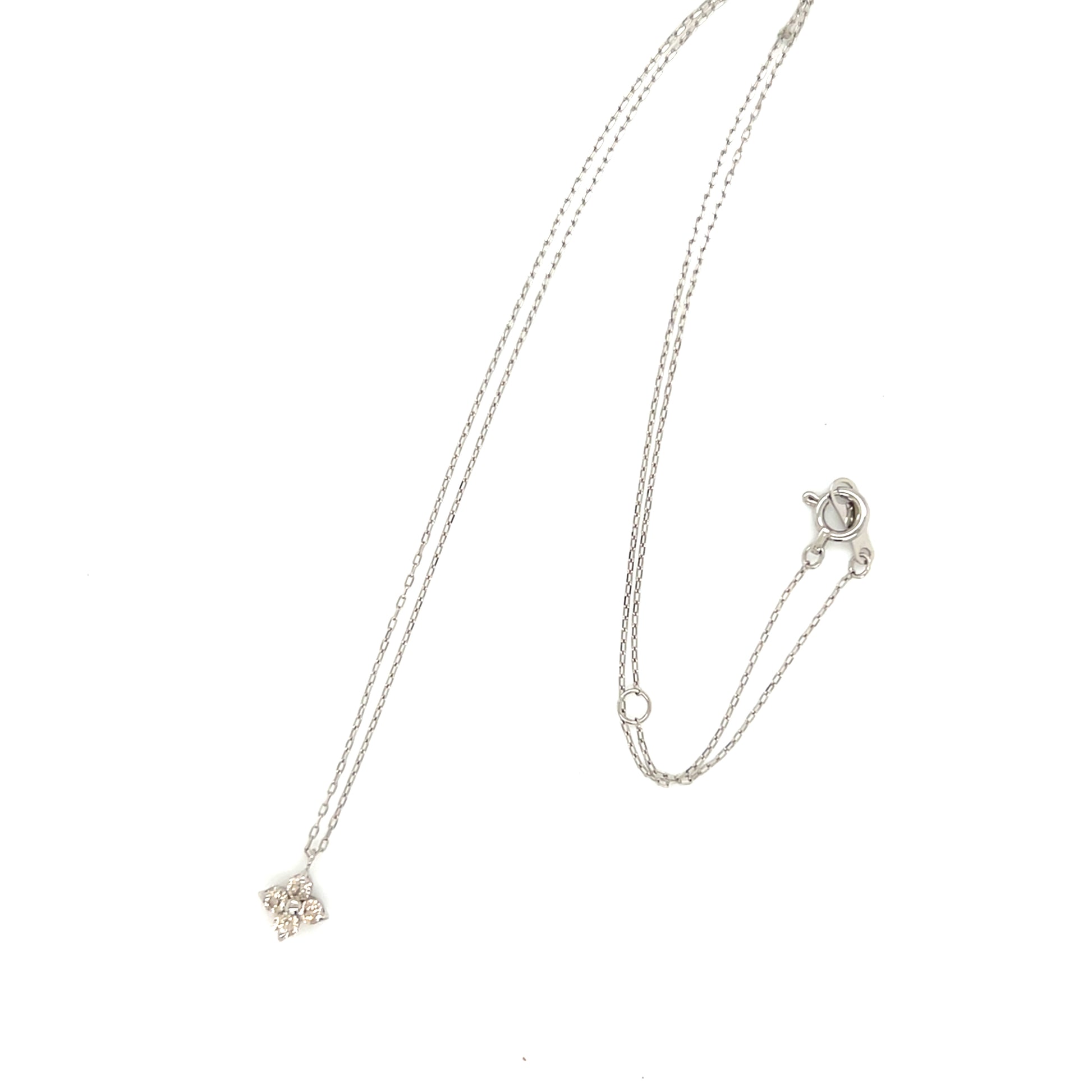 Platinum necklace with a delicate clover pendant on a white background