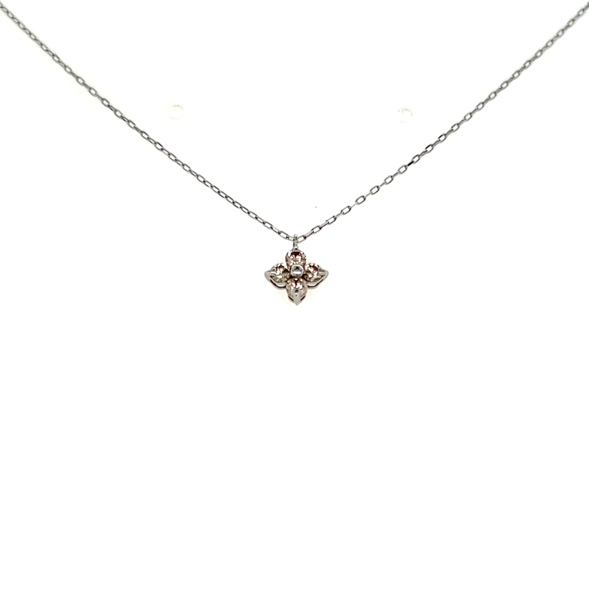 Platinum necklace with a small flower pendant on a white background