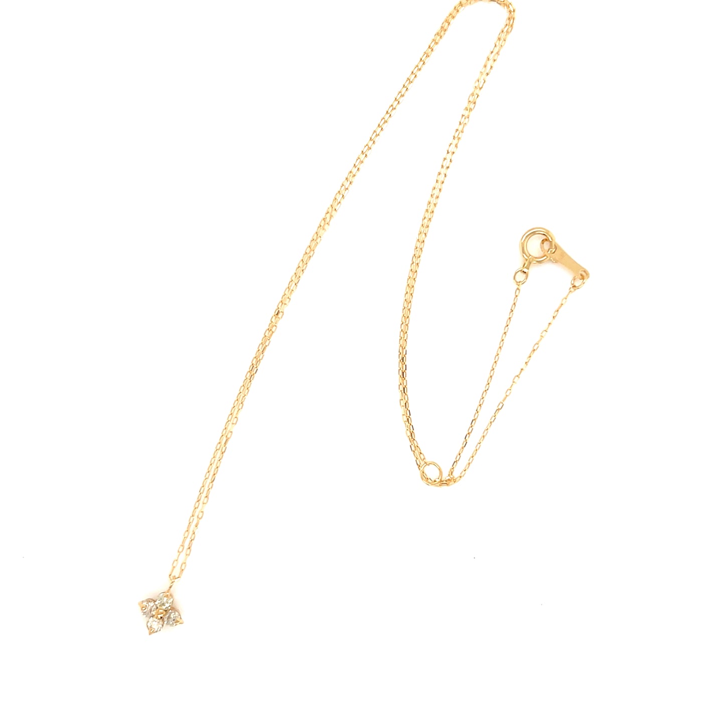 Gold necklace with a star-shaped pendant on a white background