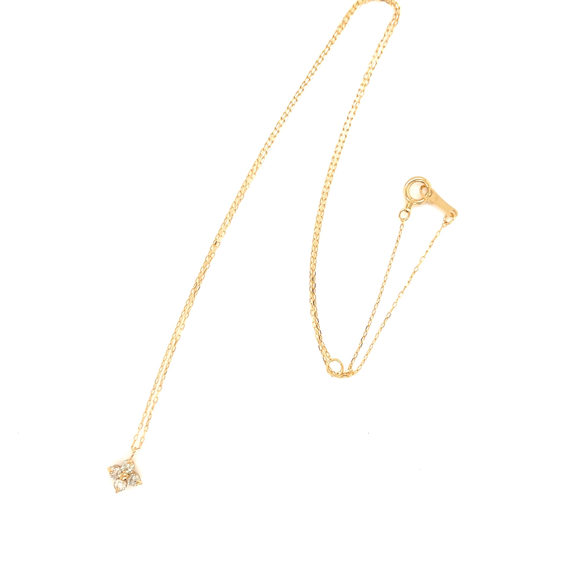 Gold necklace with a star-shaped pendant on a white background