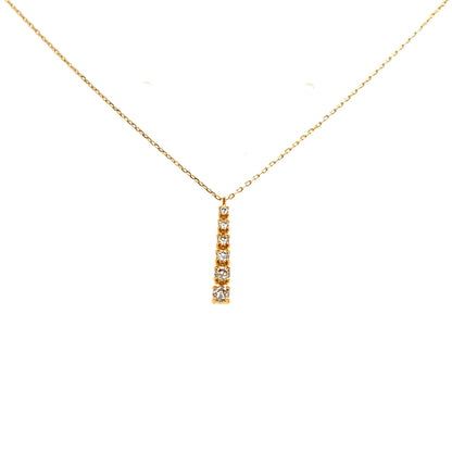 Gold necklace with a small pendant on a white background