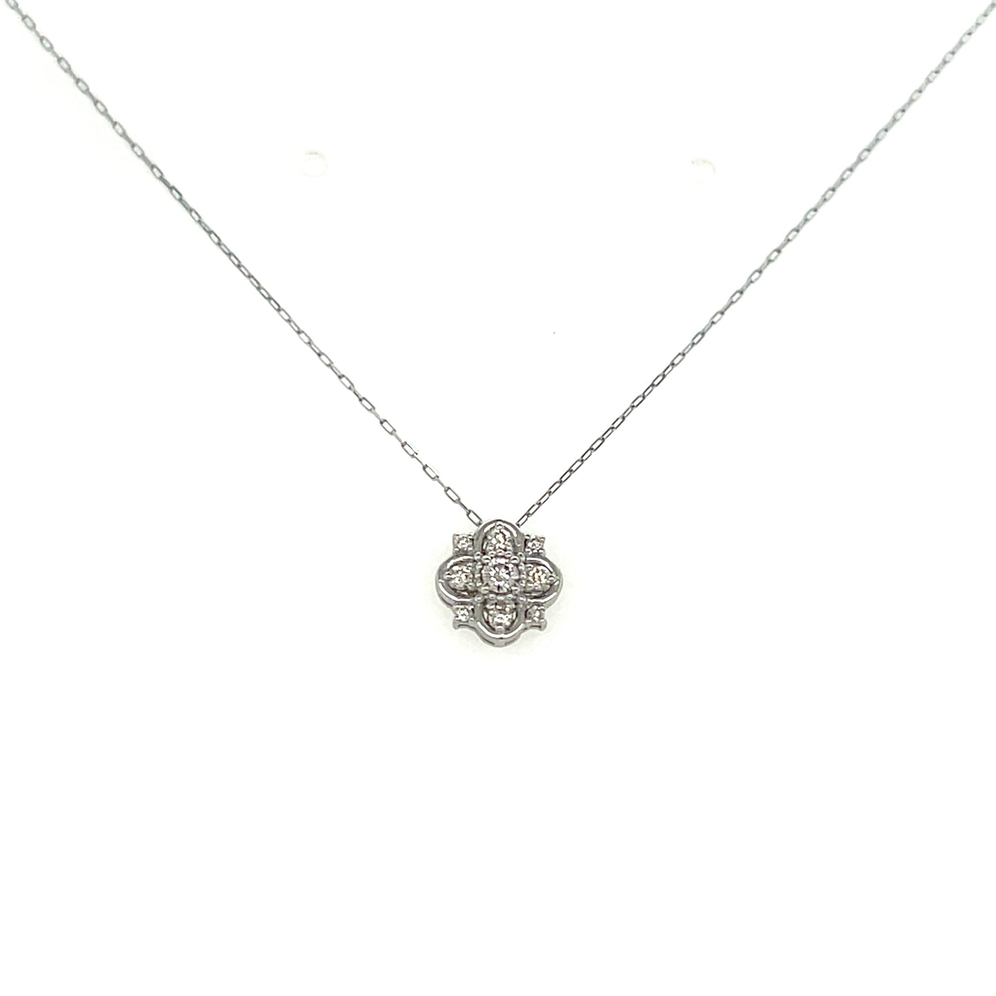 White gold necklace with a floral pendant on a white background