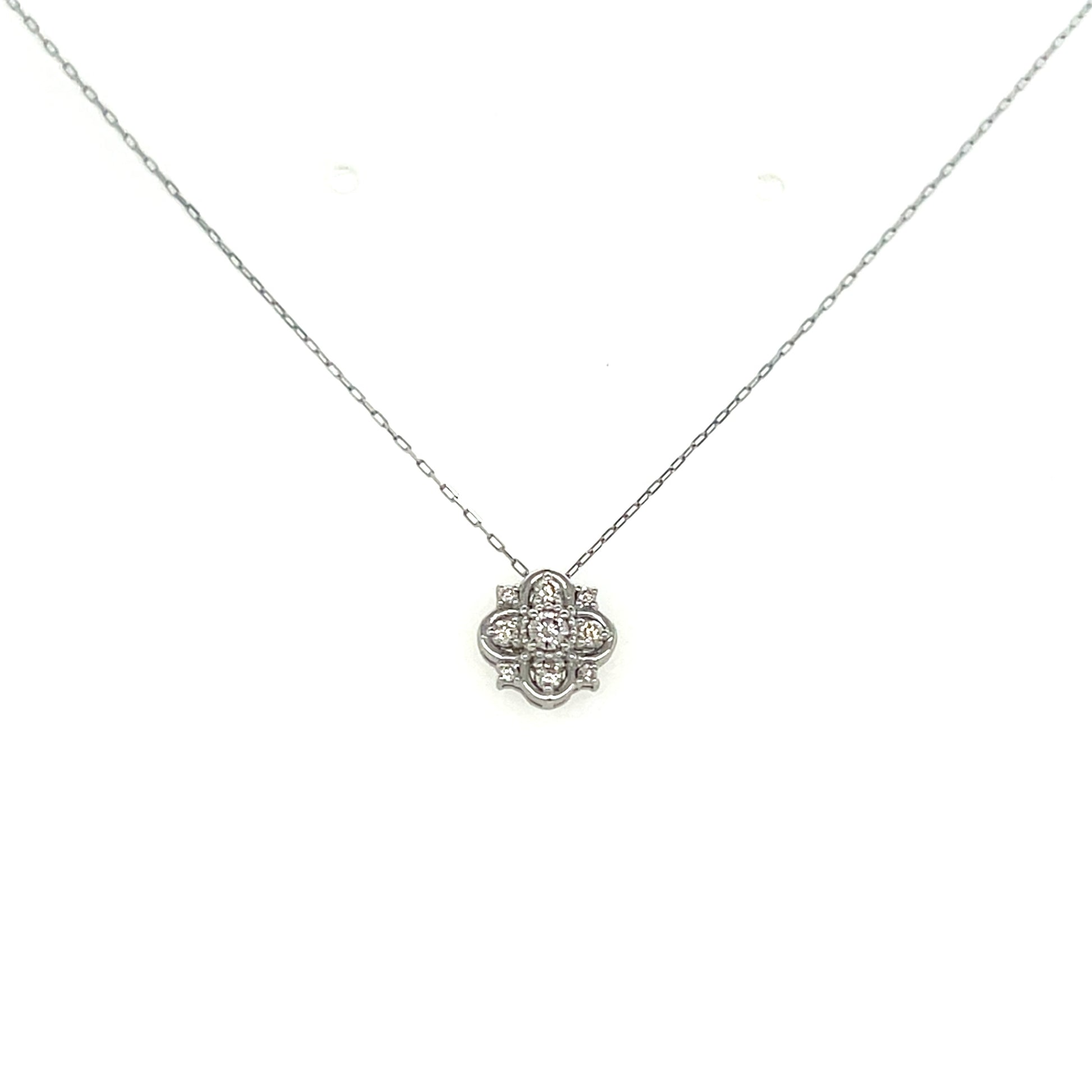 White gold necklace with a floral pendant on a white background