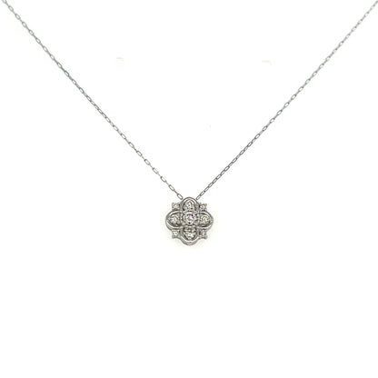 White gold necklace with a floral pendant on a white background