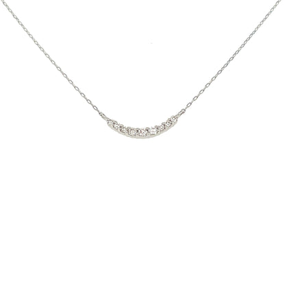 Delicate smile 18k gold necklace on a white background