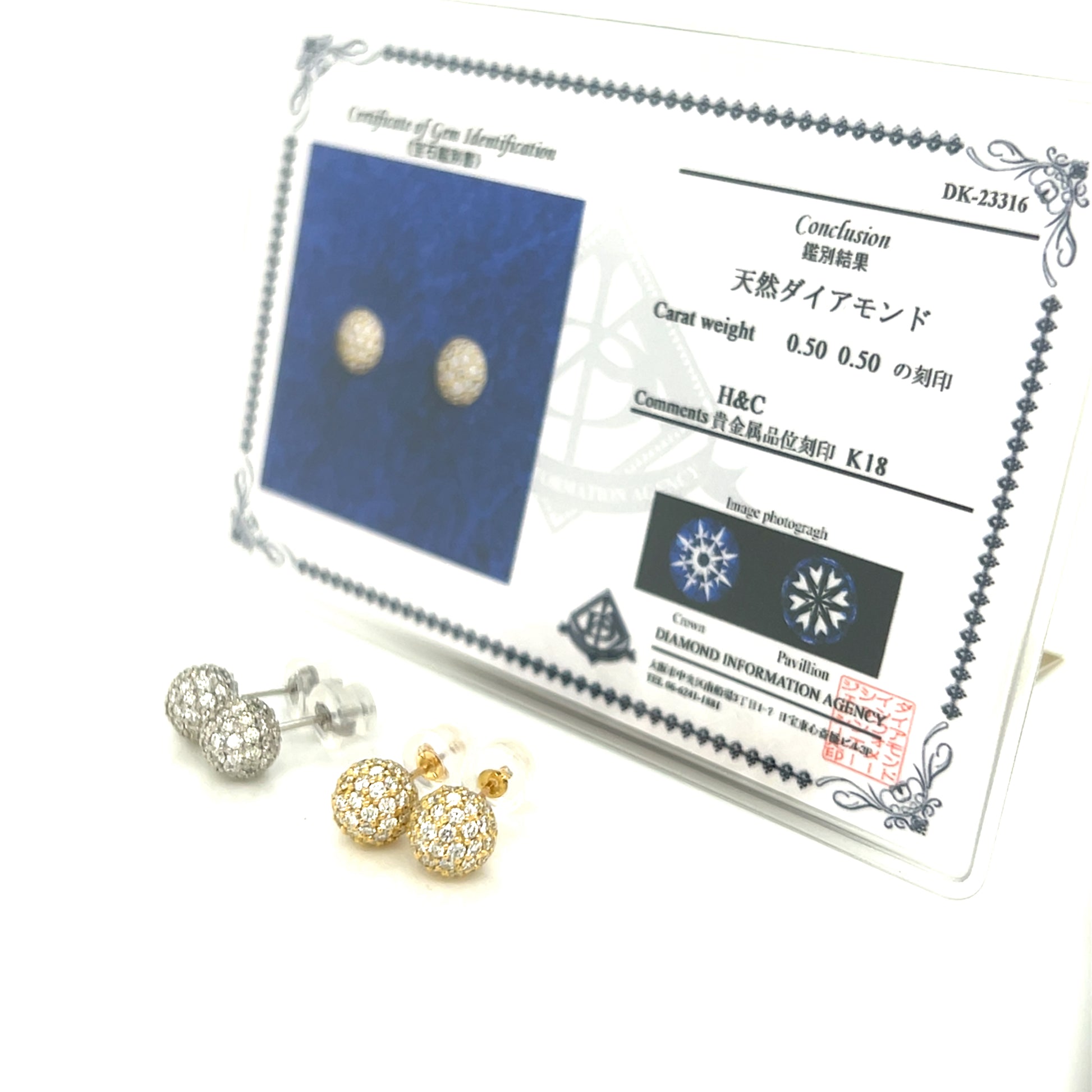 Diamond earrings with a certification card on a white background
