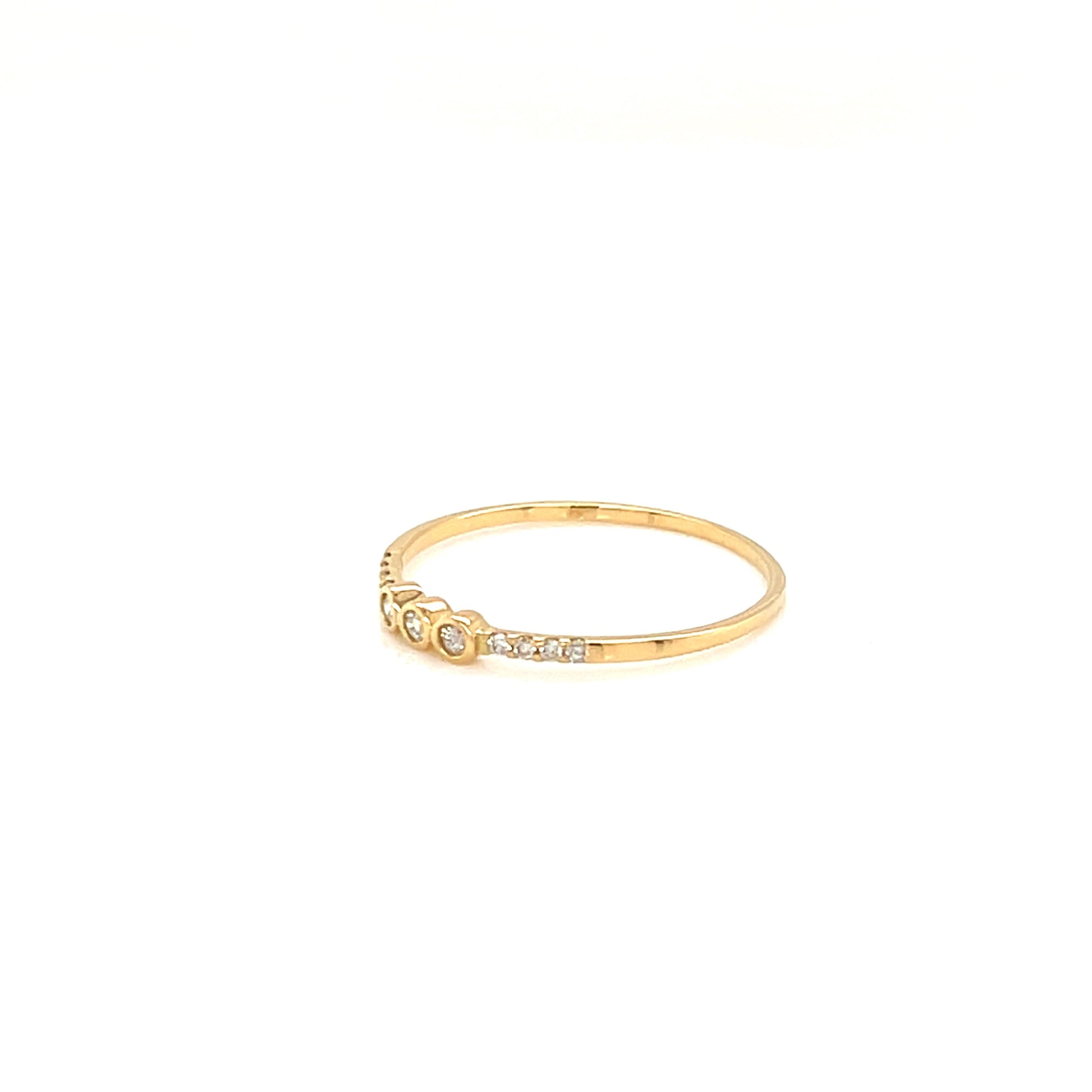 Gold ring with small diamonds on a white background