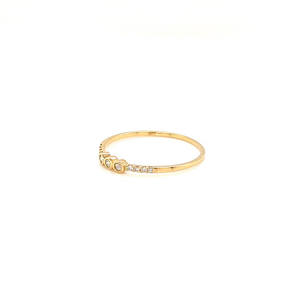 Gold ring with small diamonds on a white background