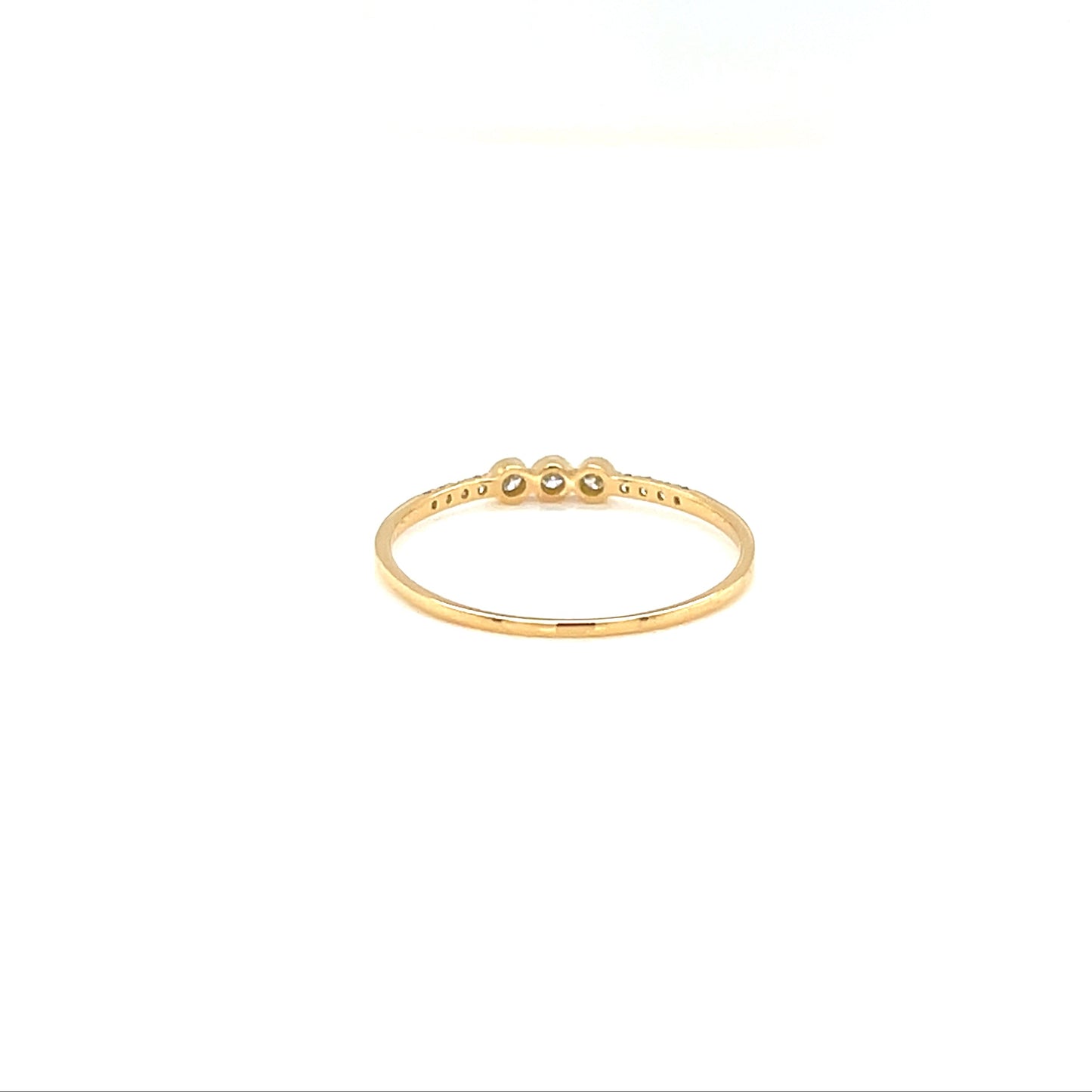 Gold ring with small stones on a white background