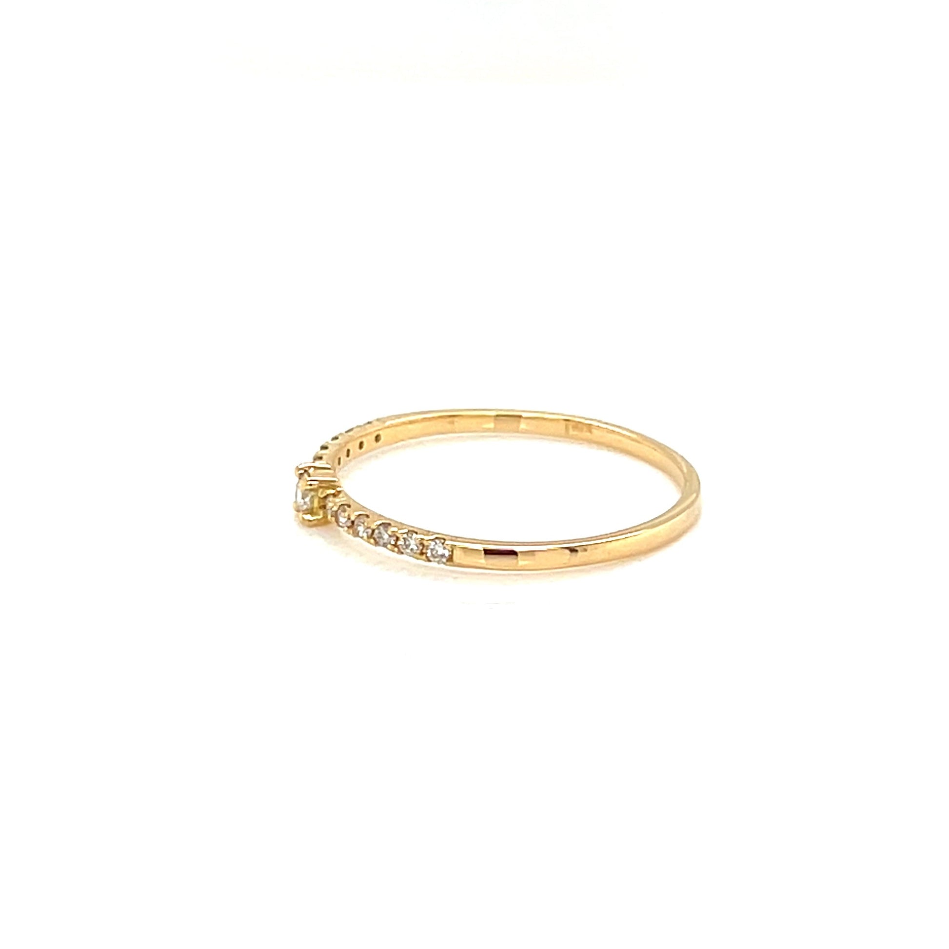 Gold ring with small diamonds on a white background