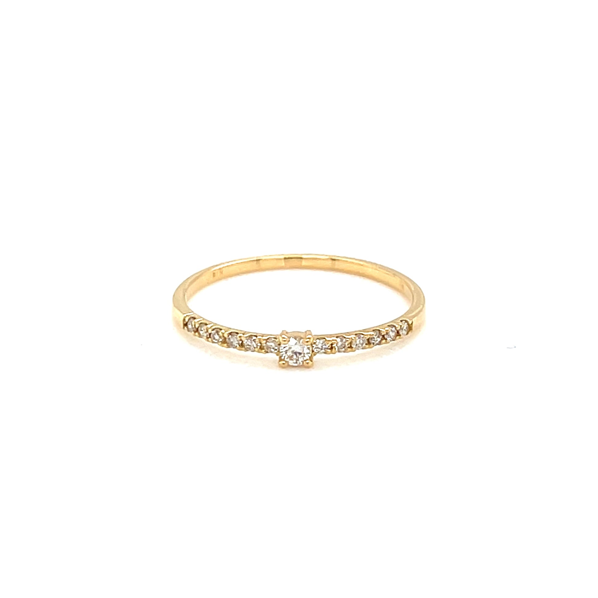Gold ring with small diamonds on a white background
