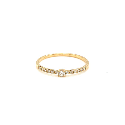 Gold ring with small diamonds on a white background