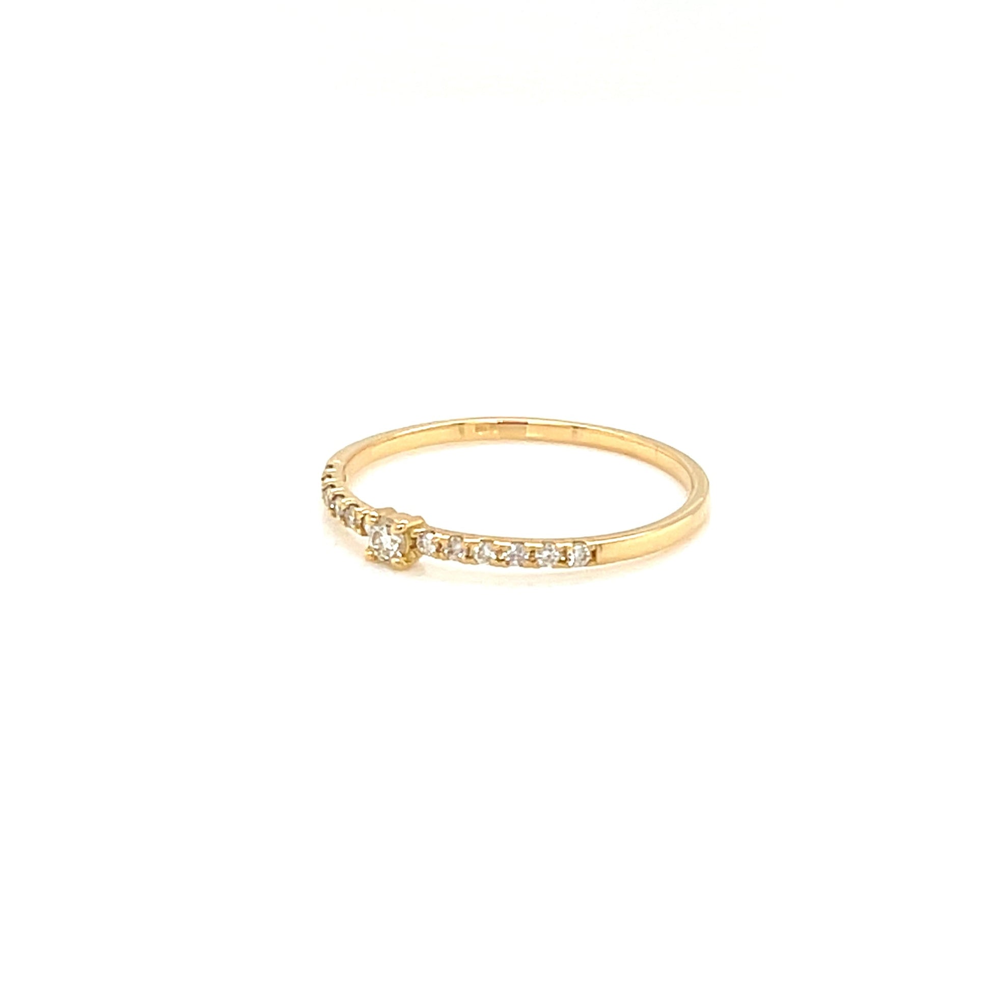 Gold ring with small diamonds on a white background