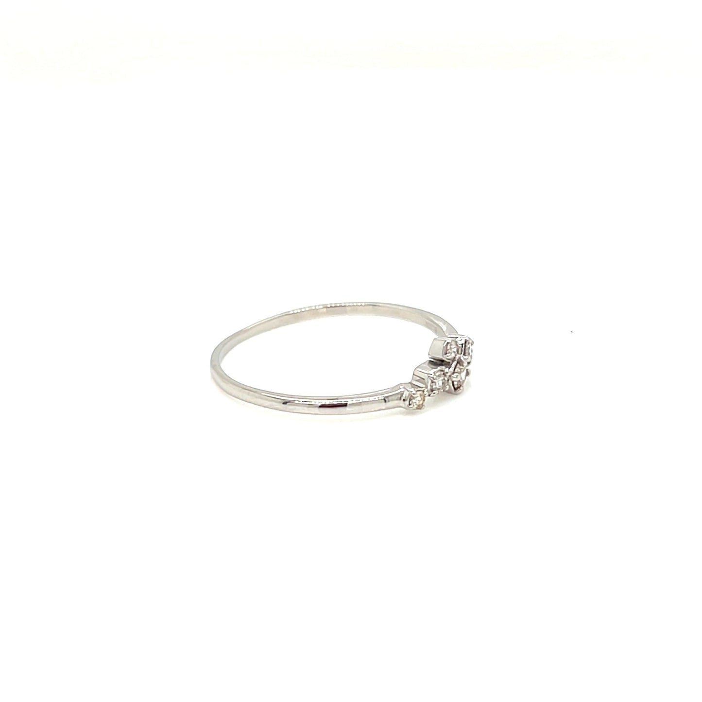 platinum ring with a small diamond on a white background