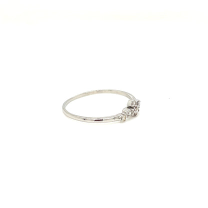 platinum ring with a small diamond on a white background