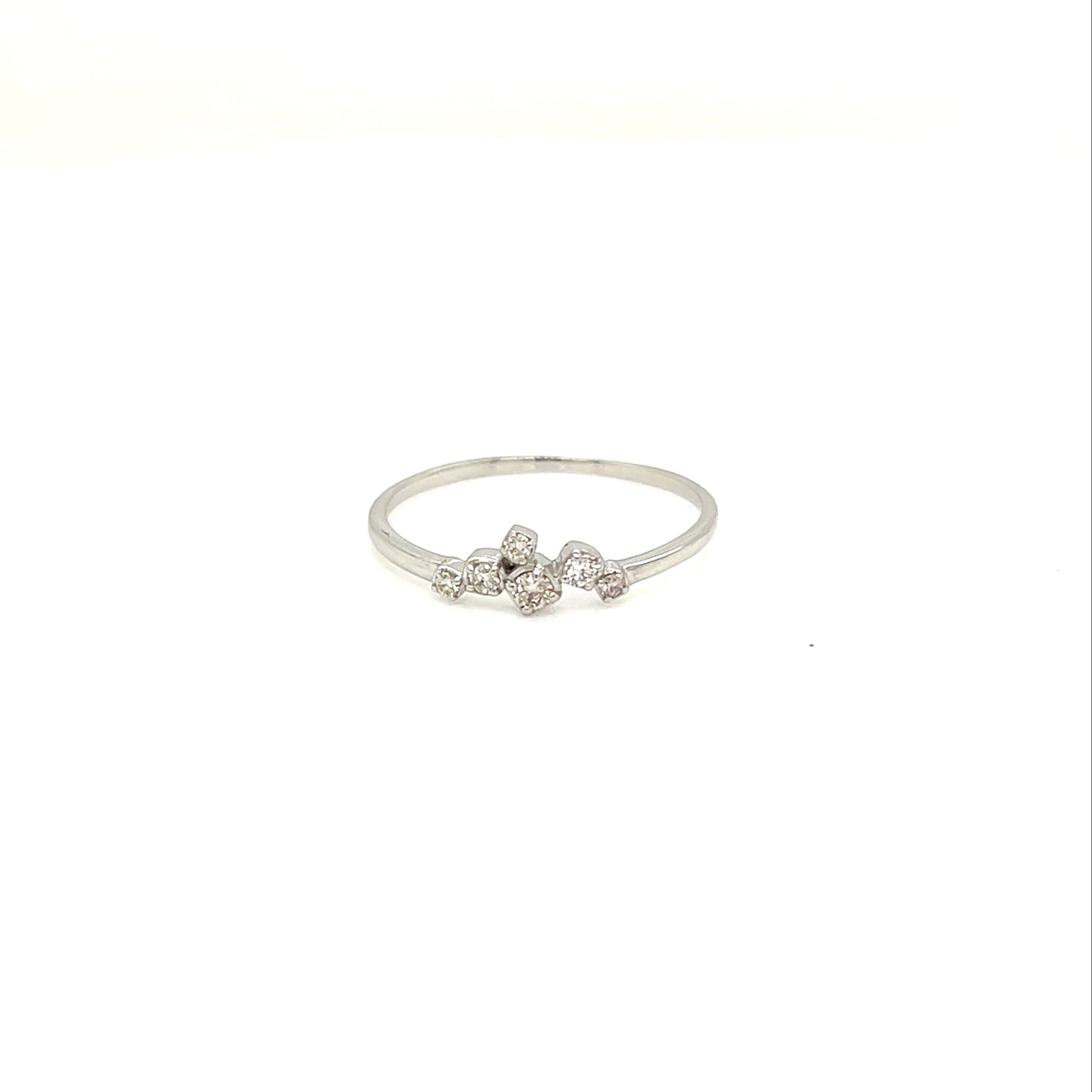 Platinum ring with small diamonds on a white background
