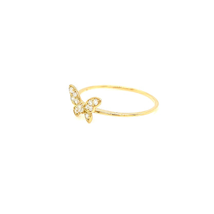 A delicate gold ring featuring a small butterfly motif paved with clear stones, set against a solid white background.