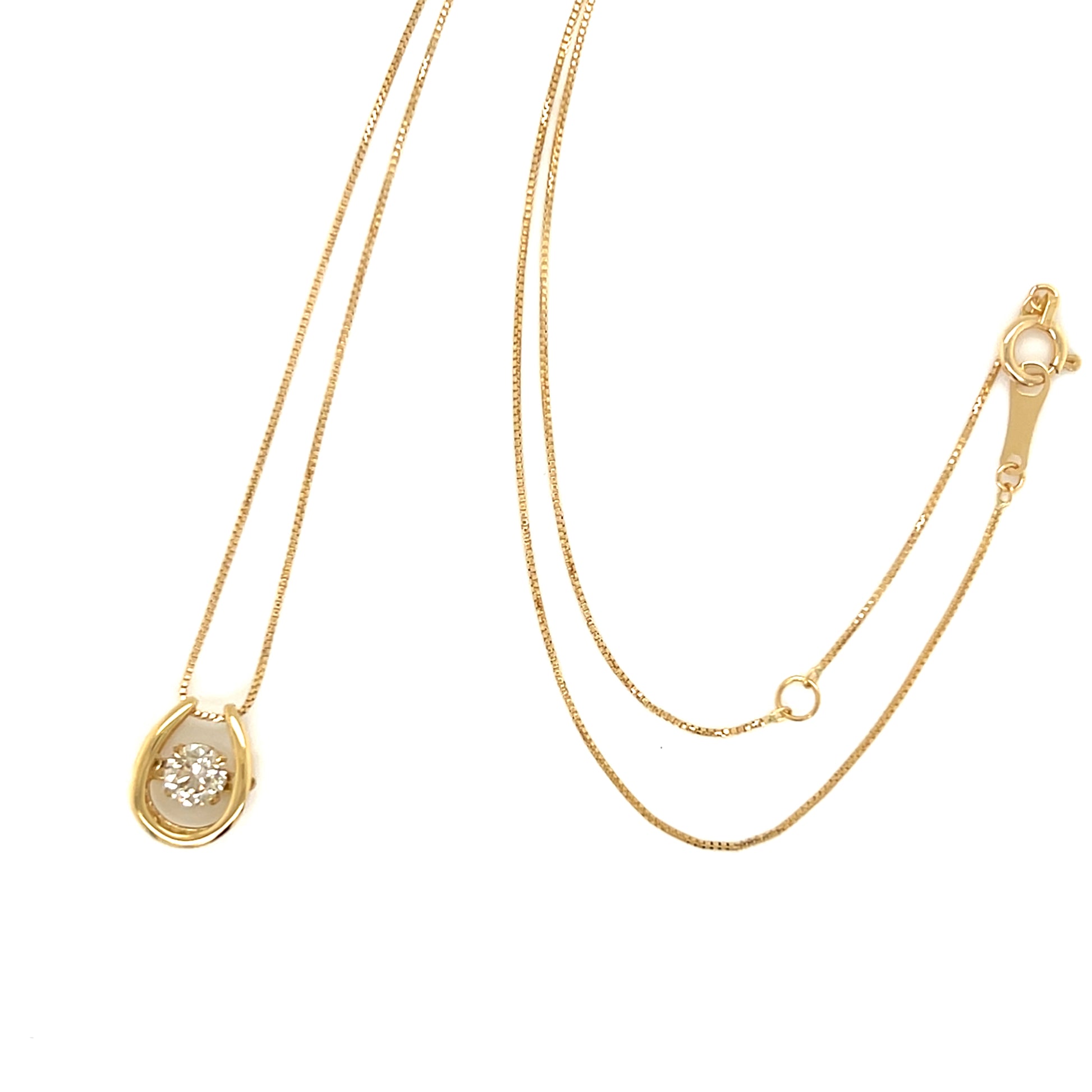 Gold necklace with a pendant on a white background