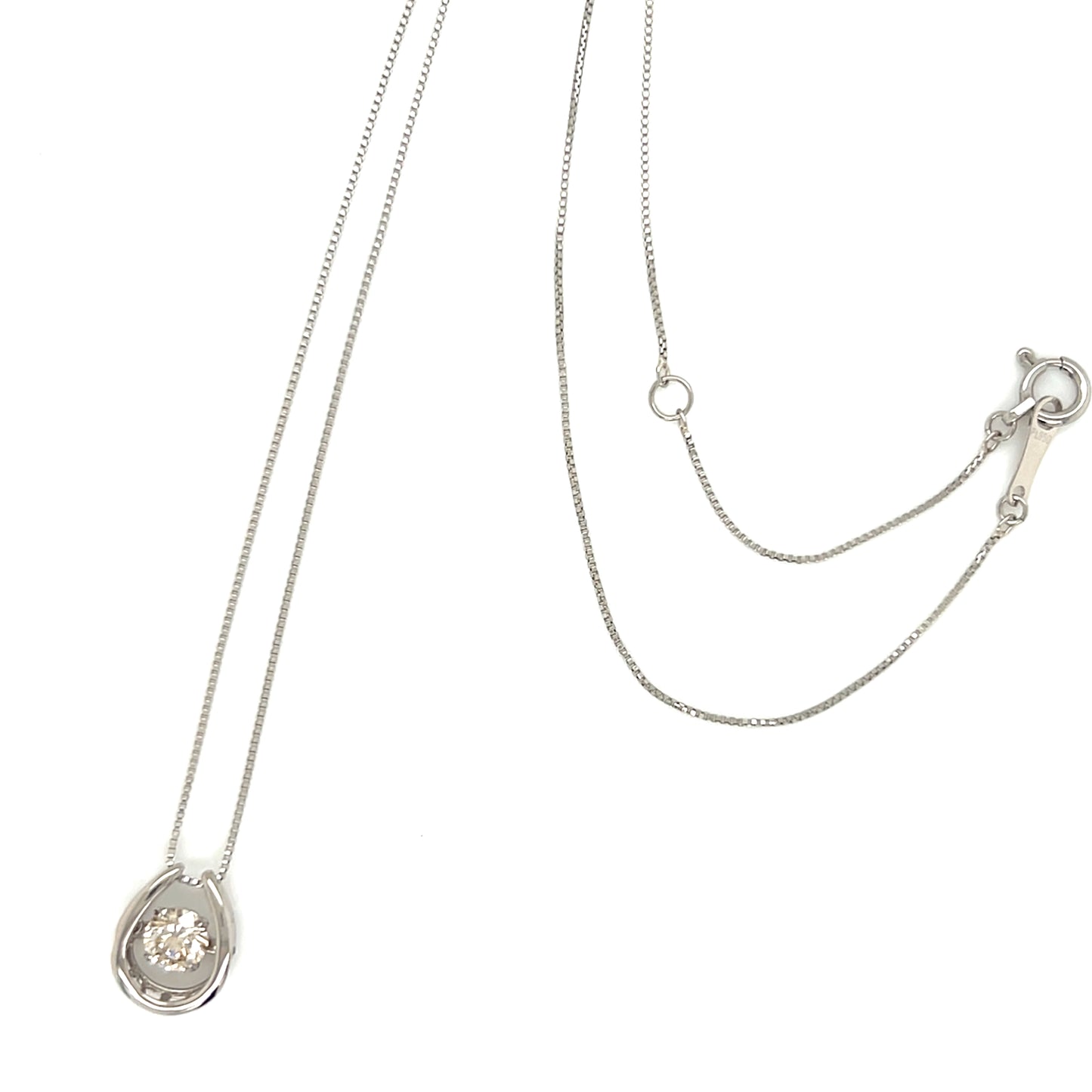 Horseshoe necklace with dancing stone on a white background