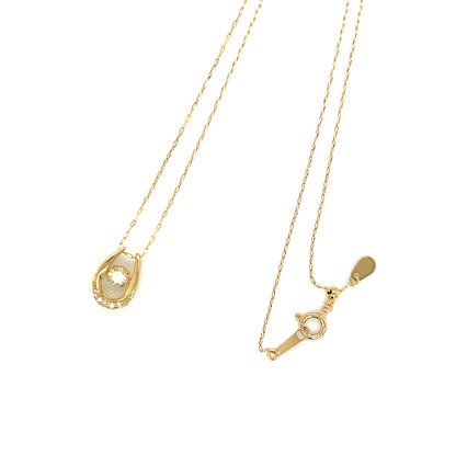 18k Gold necklace with a horseshoe pendant on a white background