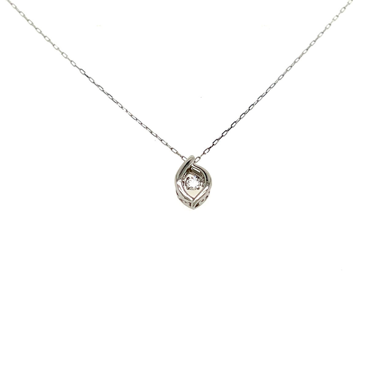 A delicate silver chain necklace with a small, textured spiral pendant holding a clear round gemstone, shown against a plain white background.