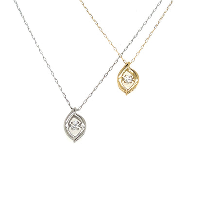 Two delicate pendant necklaces on a plain white background, one in silver-tone metal and one in yellow-gold metal, each featuring a small round clear gemstone in an open teardrop-shaped pendant.