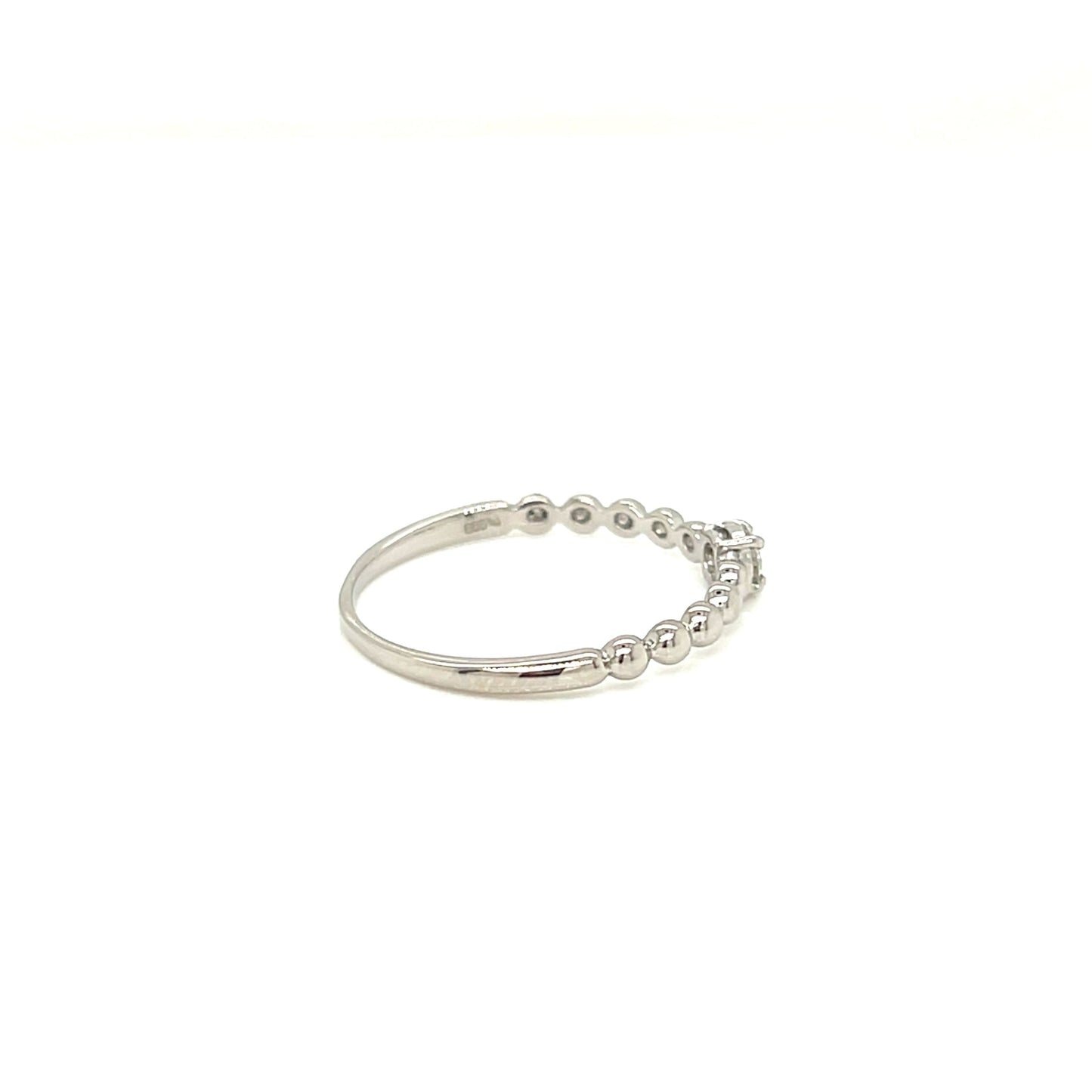 platinum ring with small diamonds on a white backfground.