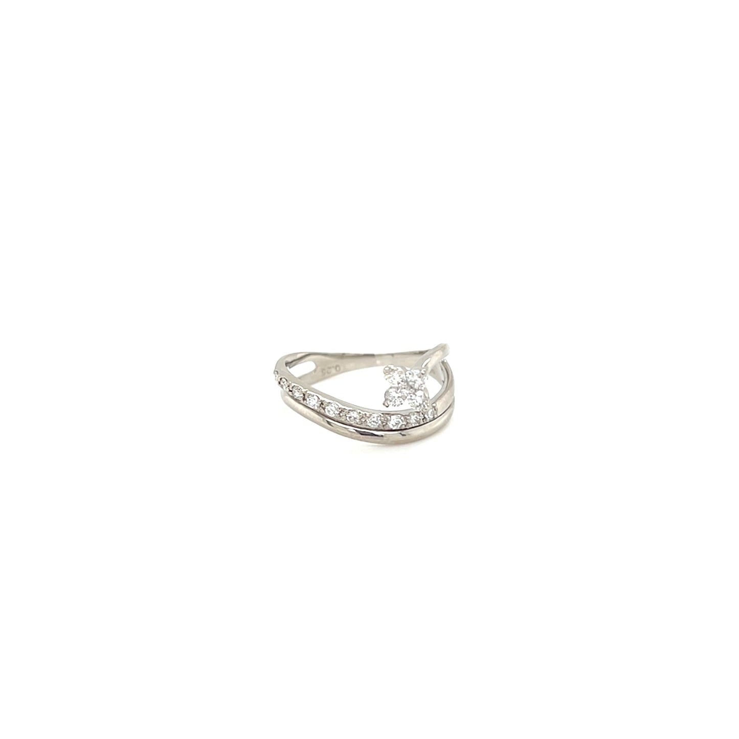 Platinum ring with a small diamond on a white background