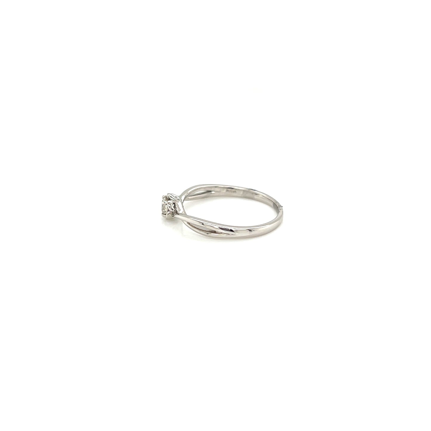 White gold ring with a small diamond on a white background