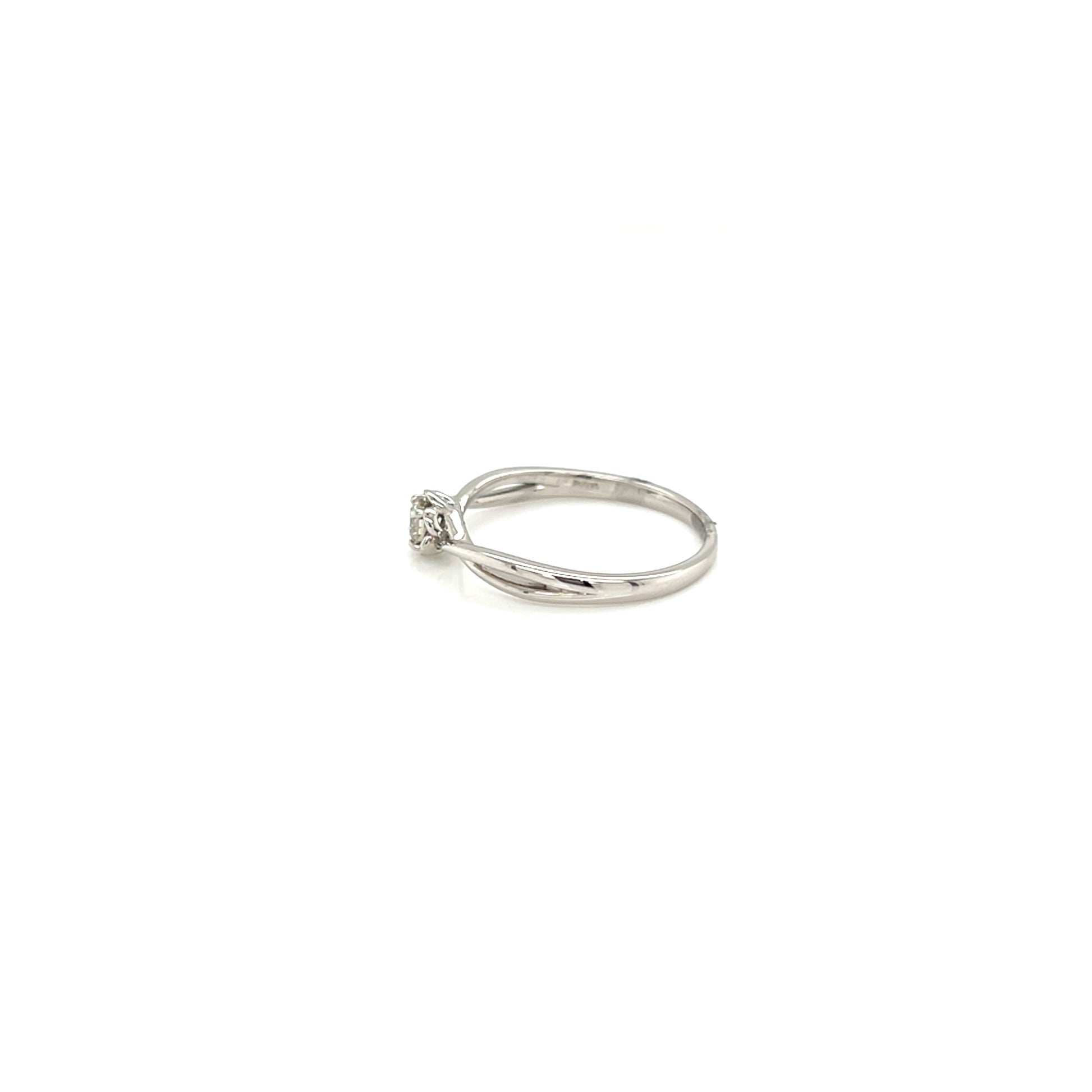 White gold ring with a small diamond on a white background