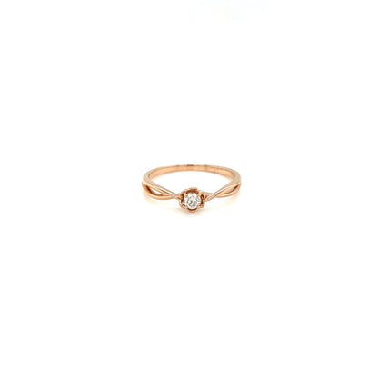 Rose gold ring with a small diamond on a white background