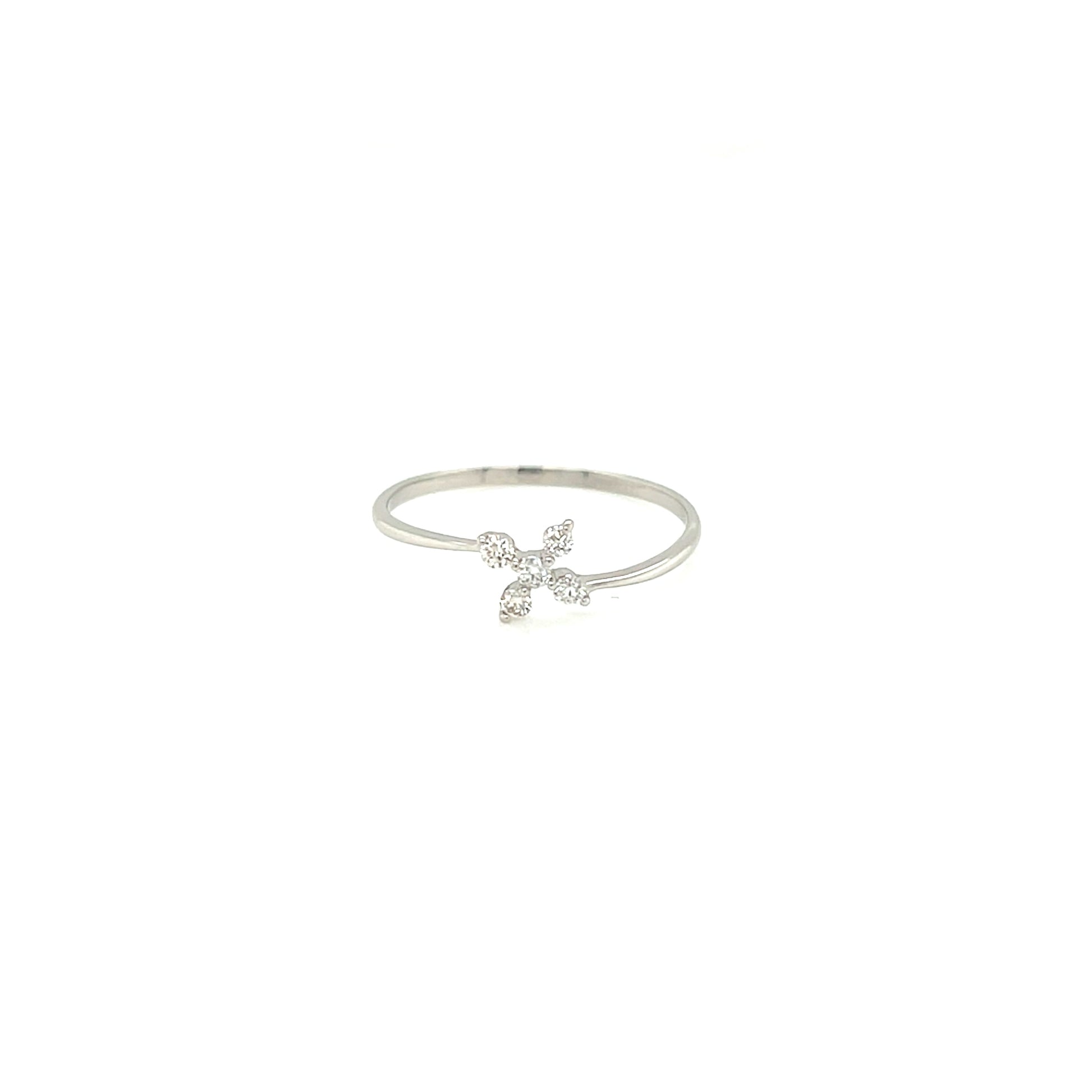 Platinum ring with a cross charm on a white background