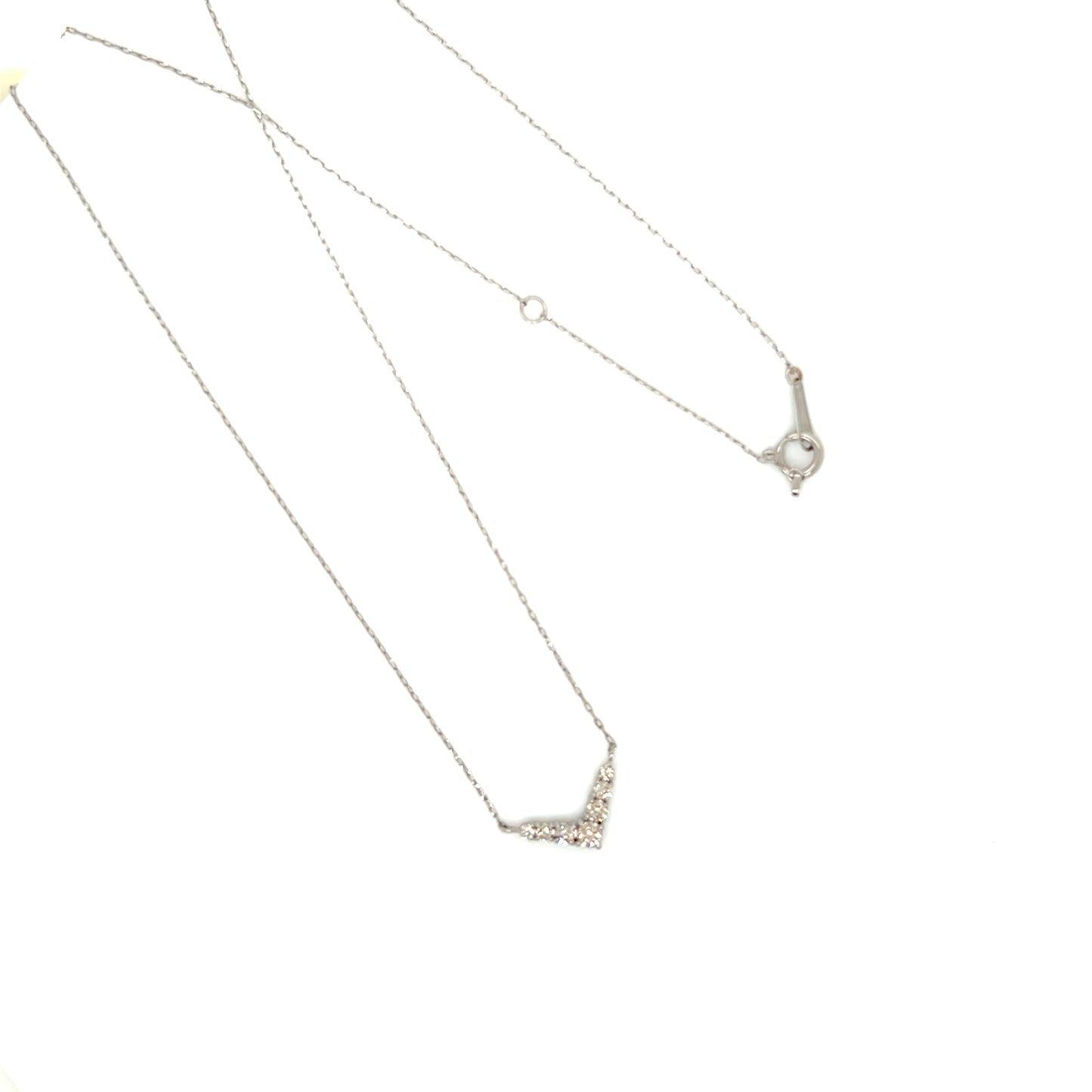Silver necklace with a v shape pendant on a white background