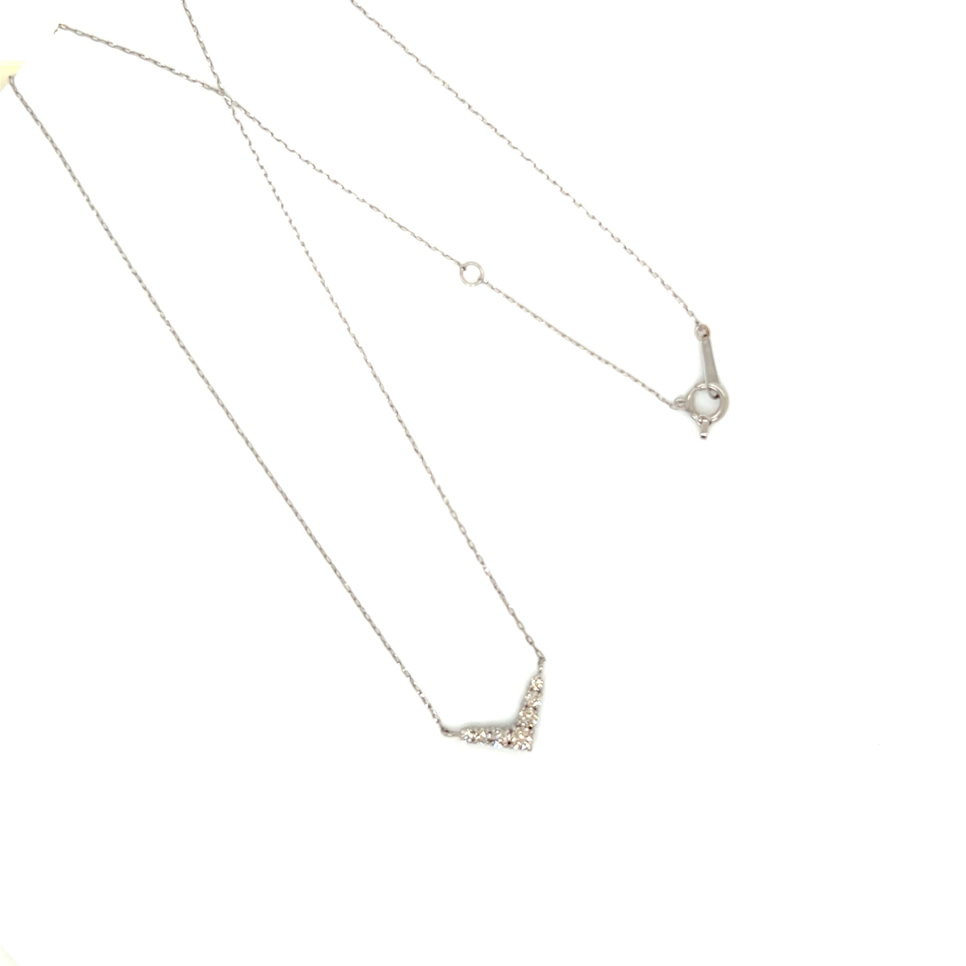 Silver necklace with a v shape pendant on a white background