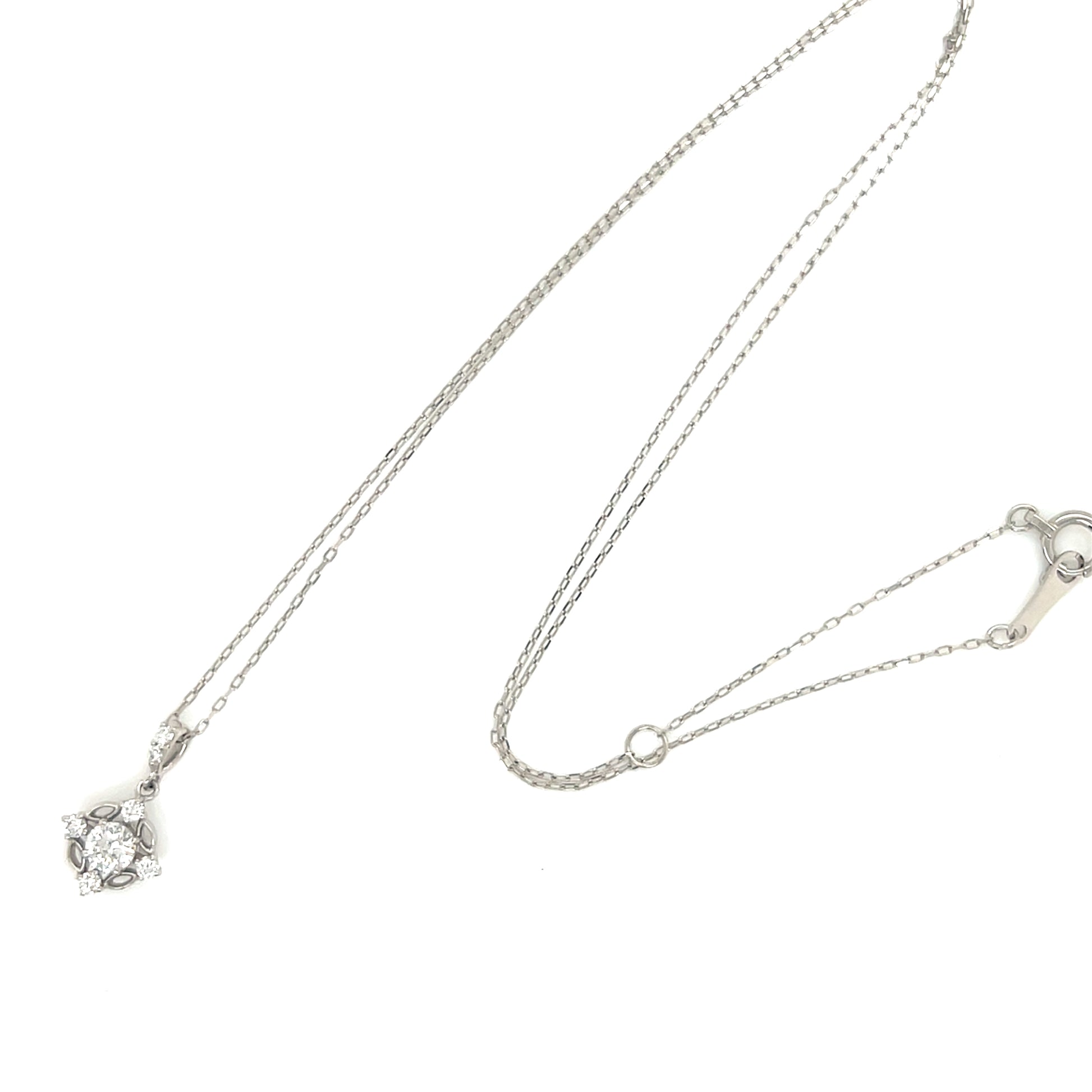 Platinum star shape necklace with natural diamond pendant on a white background