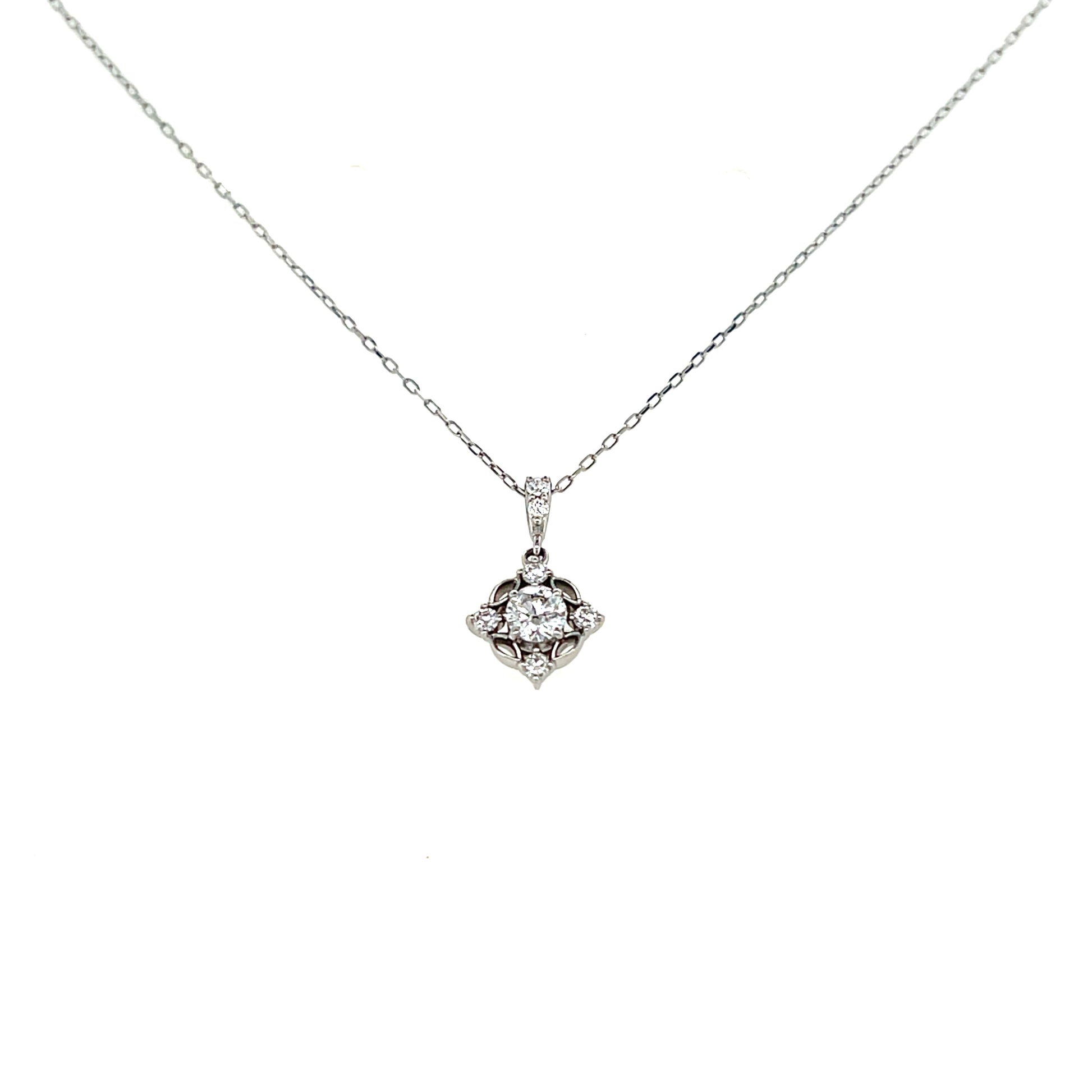 Platinum necklace with a diamond pendant on a white background