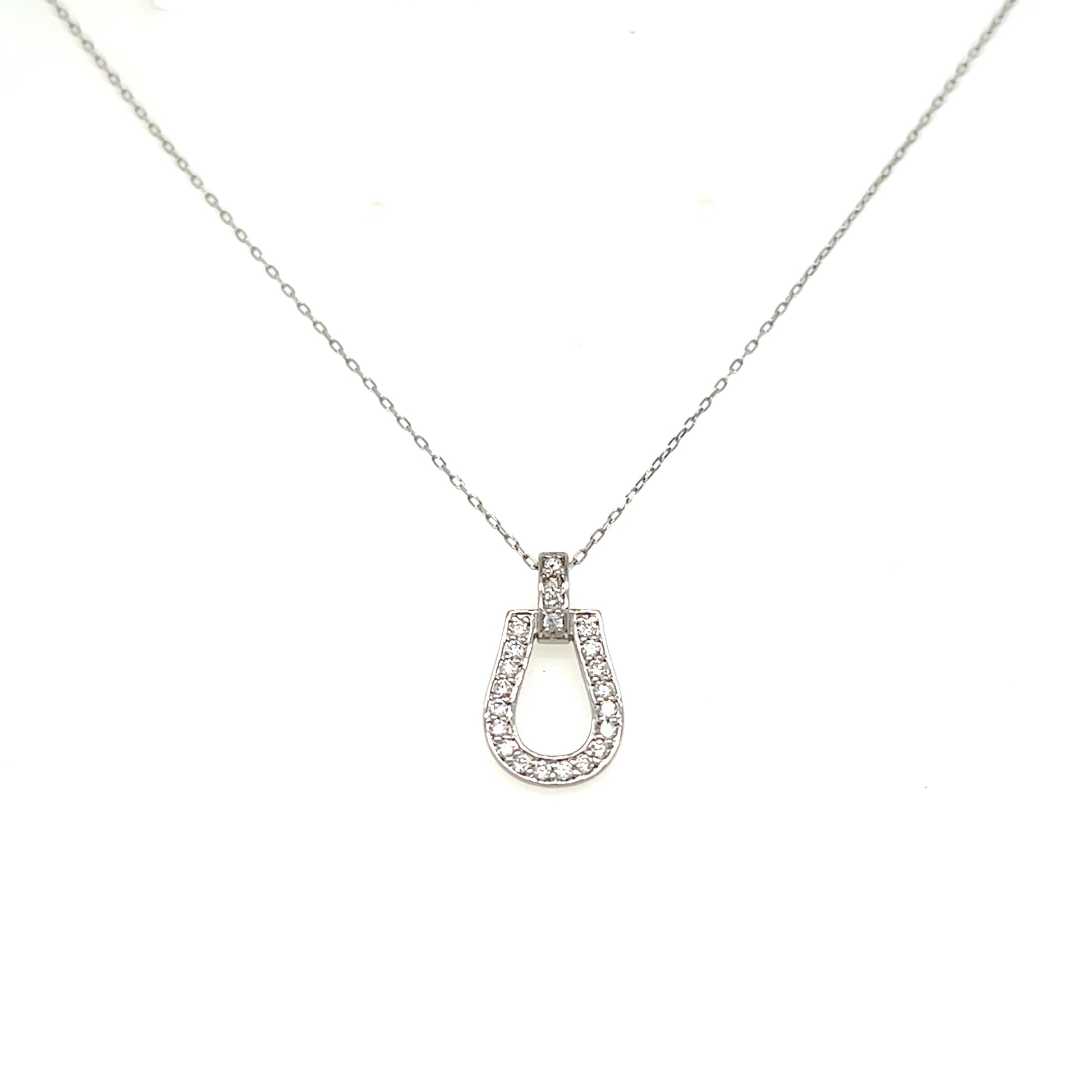 A silver horseshoe pendant necklace adorned with small clear stones, suspended from a delicate silver chain against a plain white background.