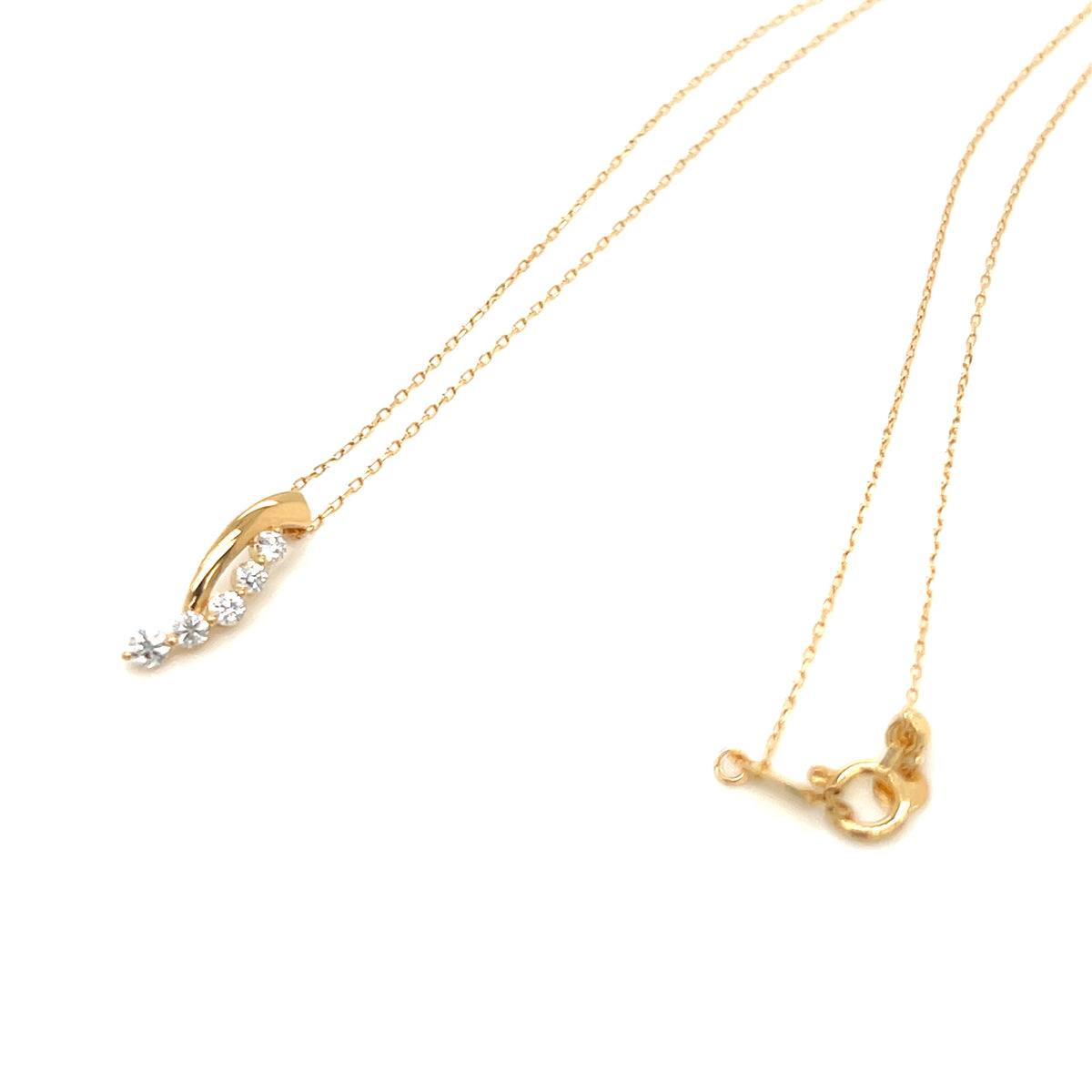 A delicate gold chain necklace with a curved leaf-shaped pendant featuring a row of small clear stones and a star detail, displayed on a clean white background.