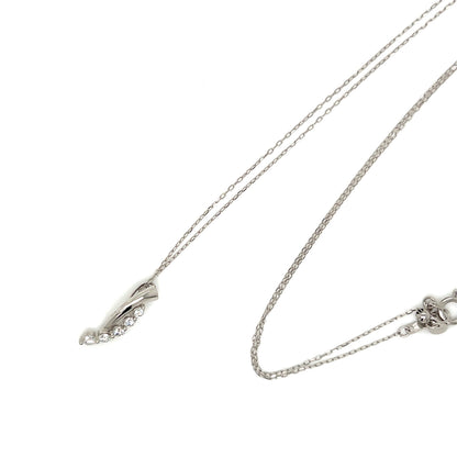 A silver-toned double-strand necklace with a delicate leaf-shaped pendant accented by small clear stones, shown on a plain white background.