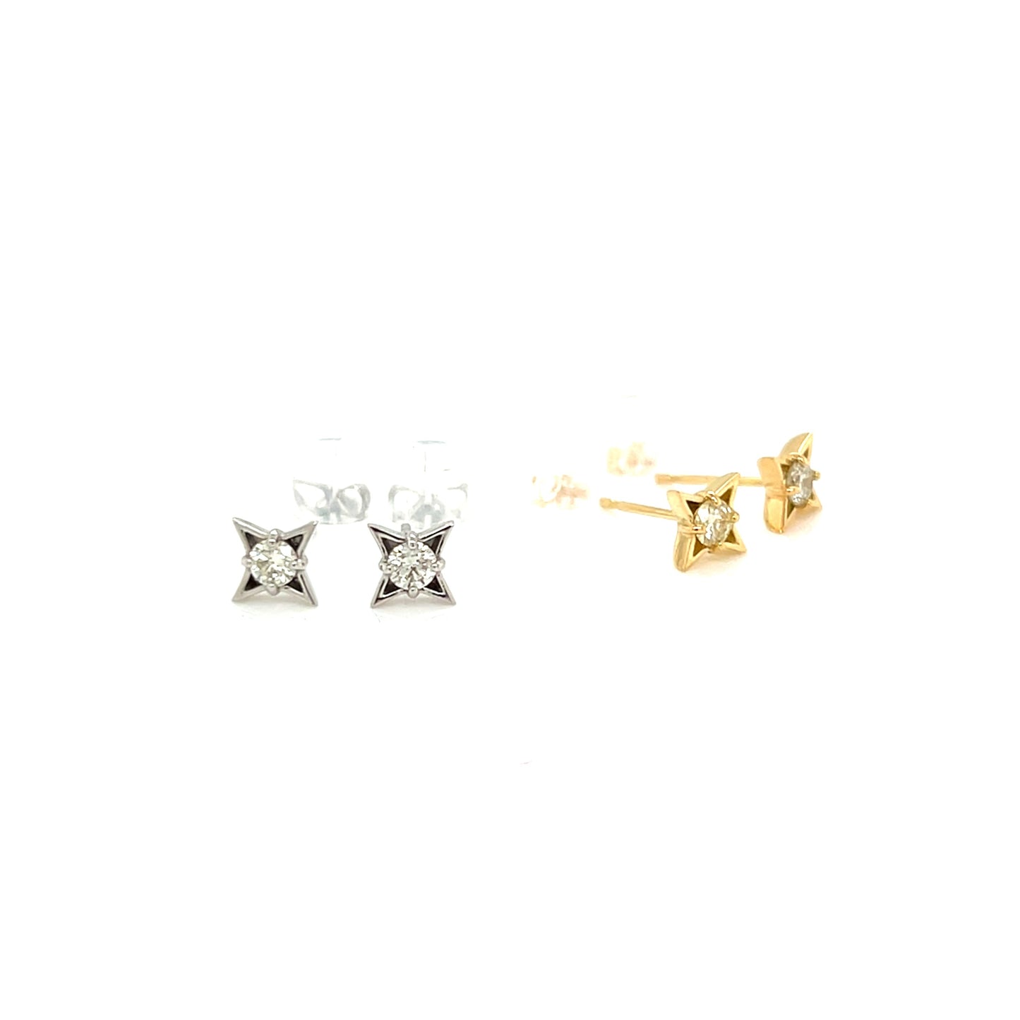 Pair of diamond stud earrings in gold and silver on a white background